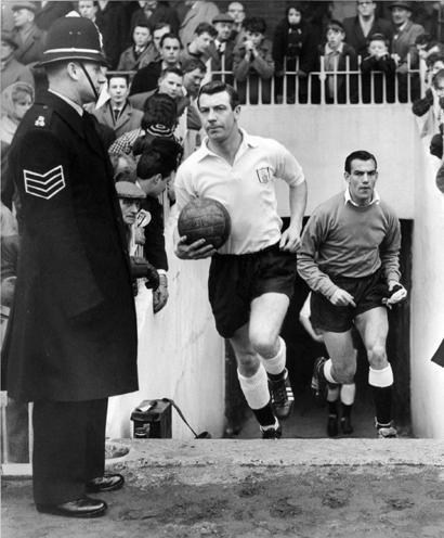 Johnny Haynes leads Fulham out